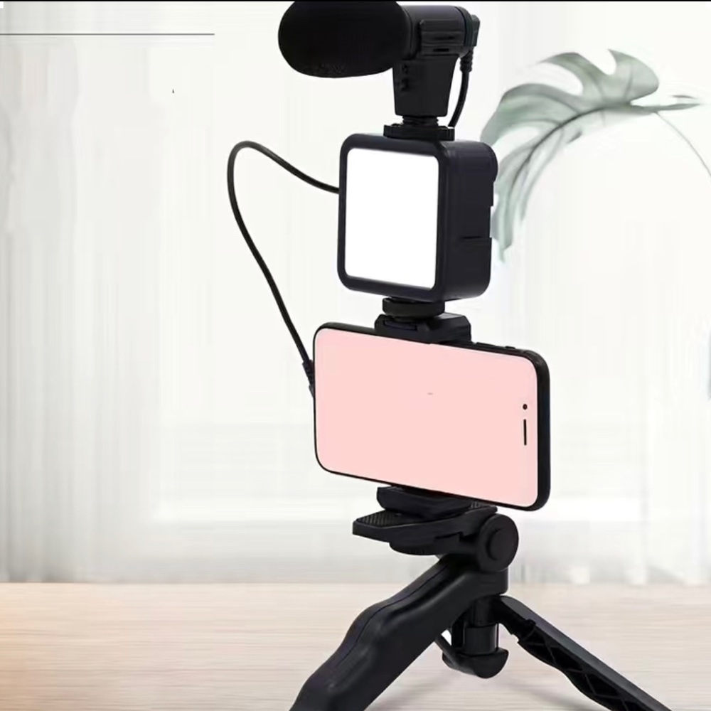 it’s a tripod it’s black and it has a light and the microphone
